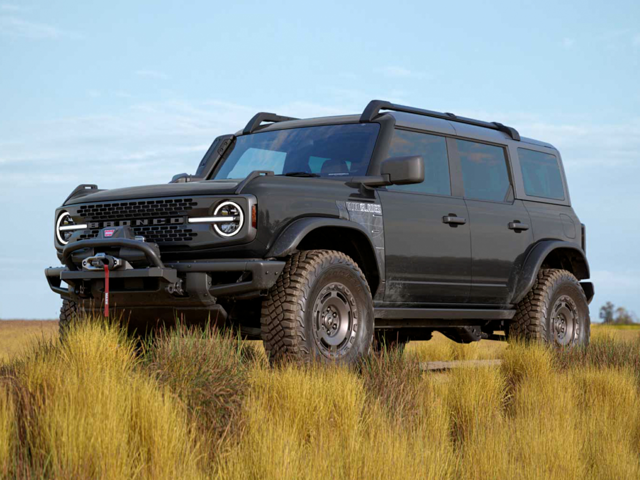 A black 2024 Ford Bronco parked in a field. | Ford Dealer in New Lexington, OH | Keer Automotive Ford